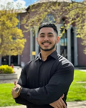 Michael Sarmento smiling outdoors